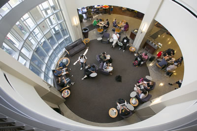 Students in the circular atrium lounge area